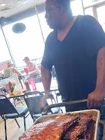 Eddie Bringing in His Masterpieces Smoked Ribs